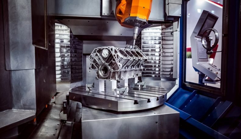 Metalworking CNC milling machine. Metalworking CNC milling machine. Cutting metal modern processing technology. Small depth of field. Warning - authentic shooting in challenging conditions. A little bit grain and maybe blurred.